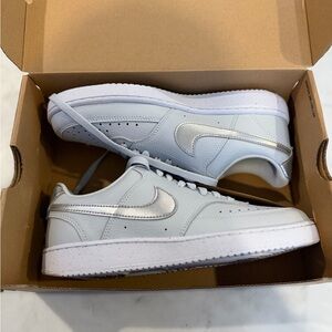 Nike Low-Top Sneakers in Pale Blue with Silver Swoosh